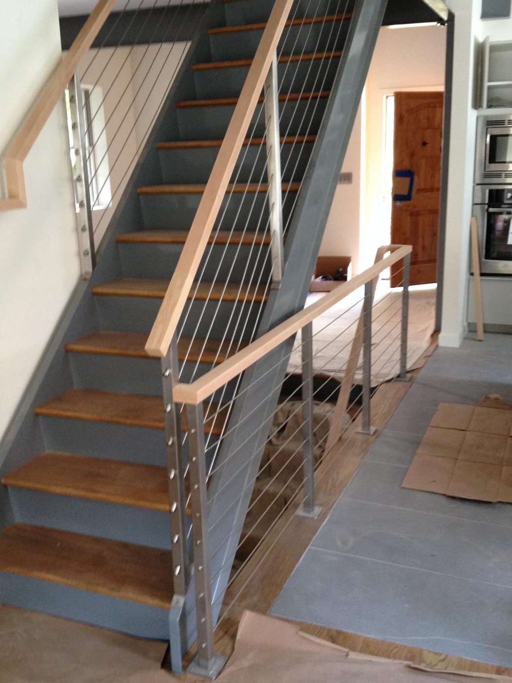 Floating steel and oak staircase with cable railing Bergen County NJ Bergen Remodeling